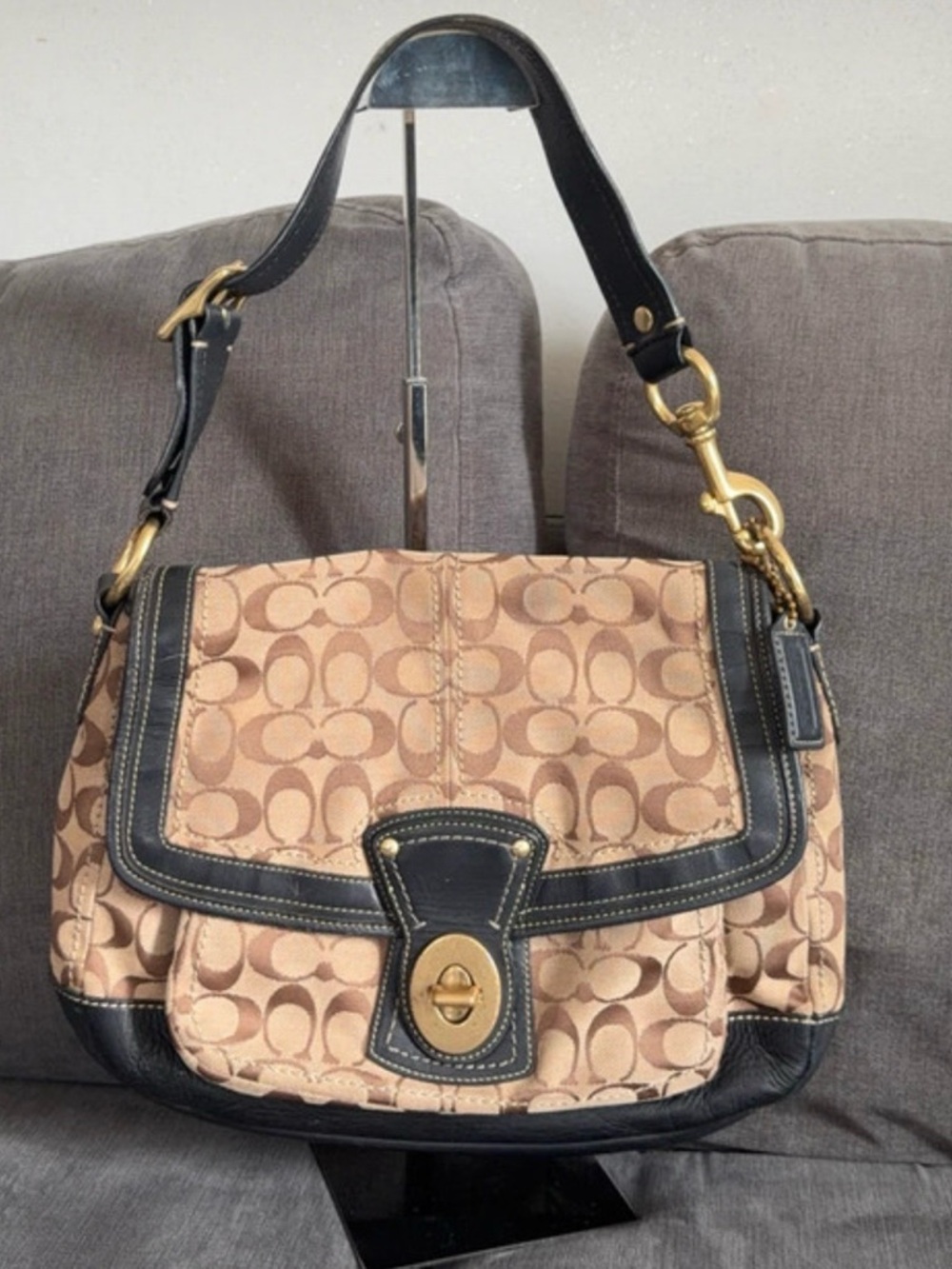 Coach legacy signature jacquard canvas shoulder bag with leather trim.